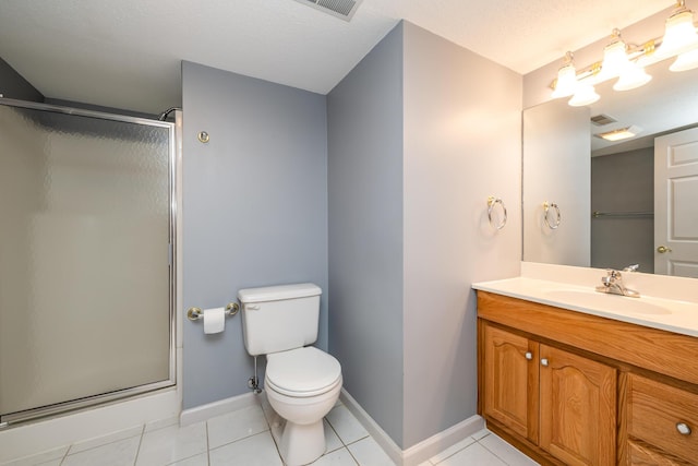 bathroom featuring vanity, toilet, an enclosed shower, and tile patterned flooring