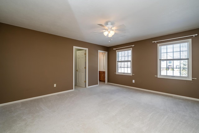 unfurnished bedroom with light colored carpet and ceiling fan