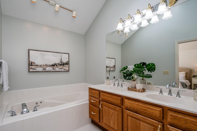 bathroom with lofted ceiling and vanity