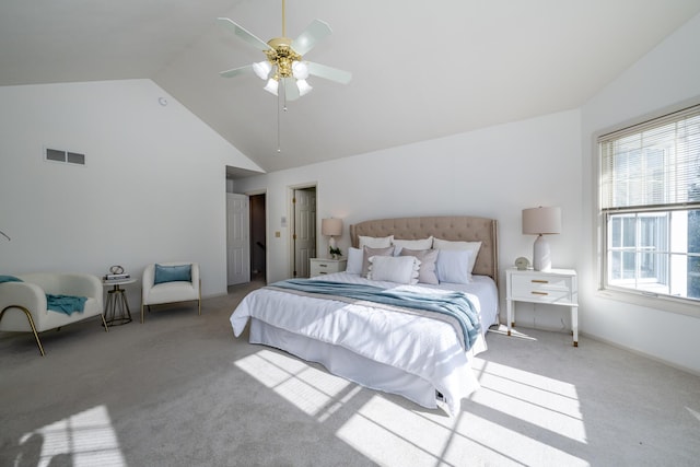 carpeted bedroom with high vaulted ceiling and ceiling fan