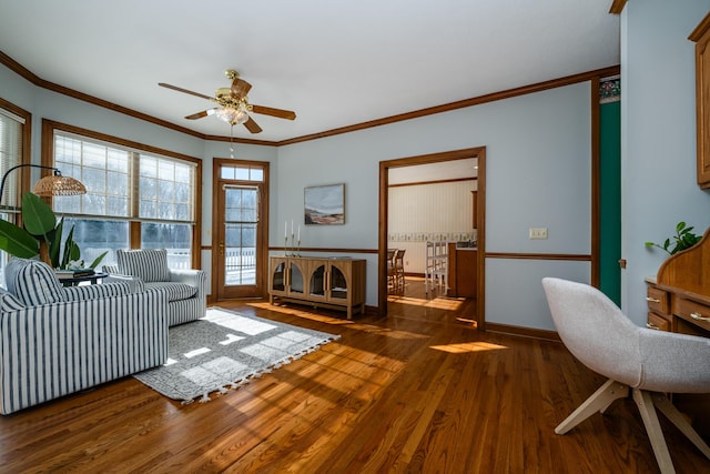 living room featuring crown molding, dark hardwood / wood-style floors, and ceiling fan