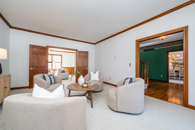 carpeted living room with crown molding and an inviting chandelier