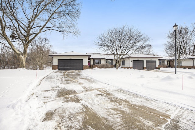 ranch-style home featuring a garage