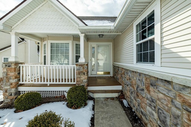 view of snow covered property entrance