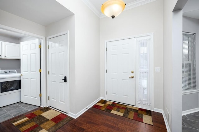 entrance foyer with crown molding, washer / dryer, and dark hardwood / wood-style flooring