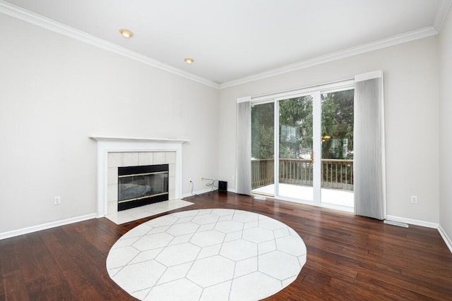 living room featuring hardwood / wood-style flooring, ornamental molding, and a fireplace