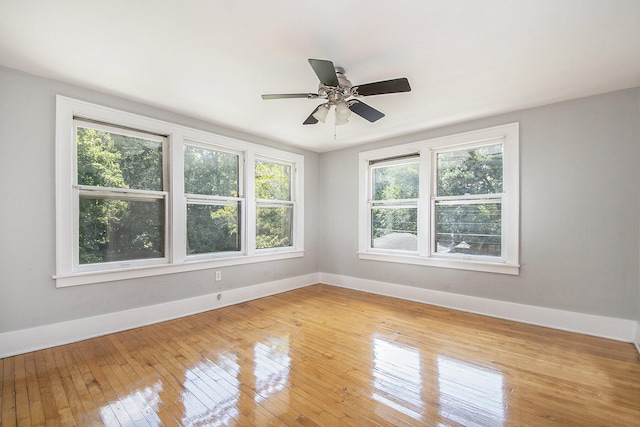 spare room with wood-type flooring and ceiling fan