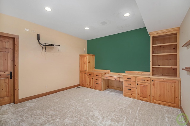 unfurnished bedroom with light colored carpet