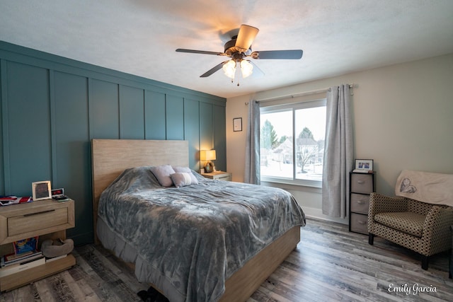 bedroom with hardwood / wood-style flooring and ceiling fan