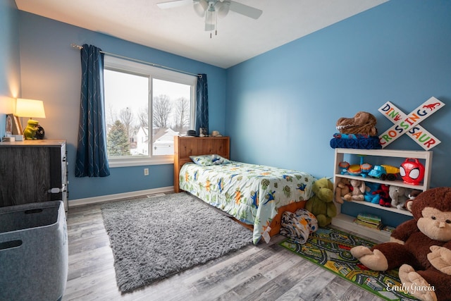 bedroom featuring wood-type flooring and ceiling fan