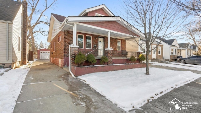 view of front of property featuring a garage and a porch