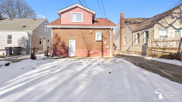 view of snow covered house