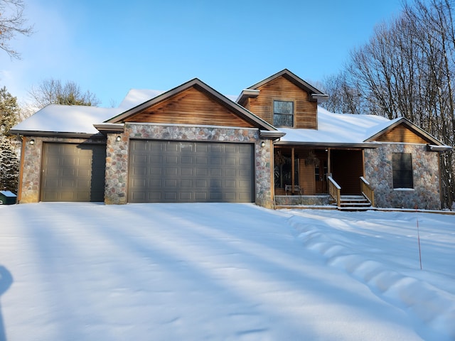 view of front facade featuring a garage and covered porch