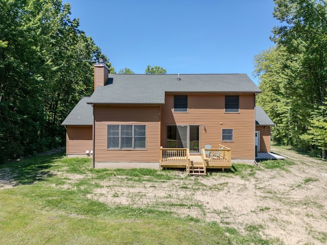 back of house with a wooden deck