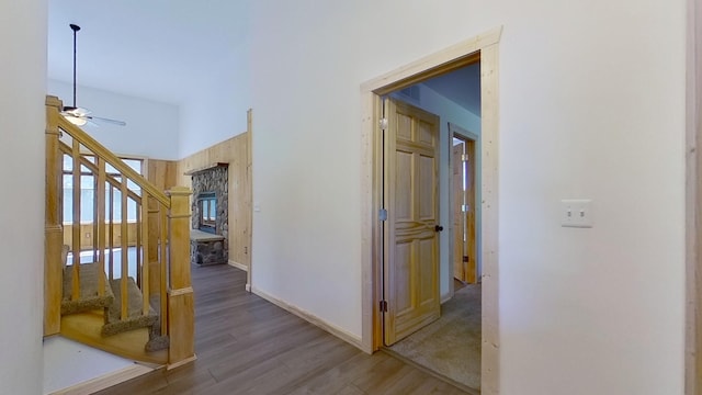 hallway with hardwood / wood-style flooring