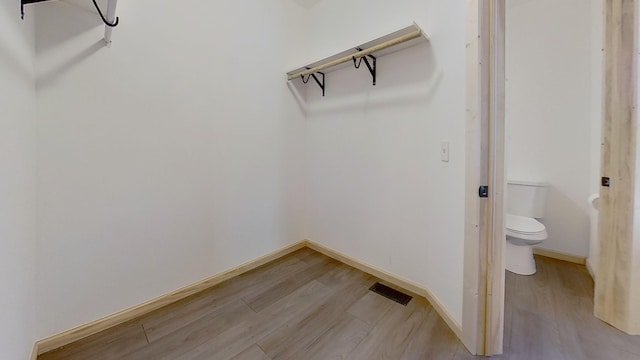 spacious closet featuring light hardwood / wood-style floors