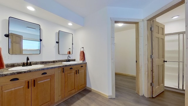 bathroom featuring vanity and hardwood / wood-style floors