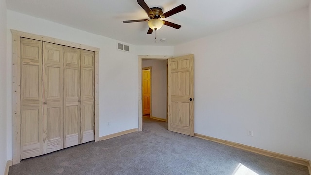 unfurnished bedroom featuring ceiling fan, carpet floors, and a closet