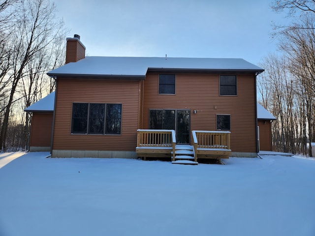 view of snow covered house