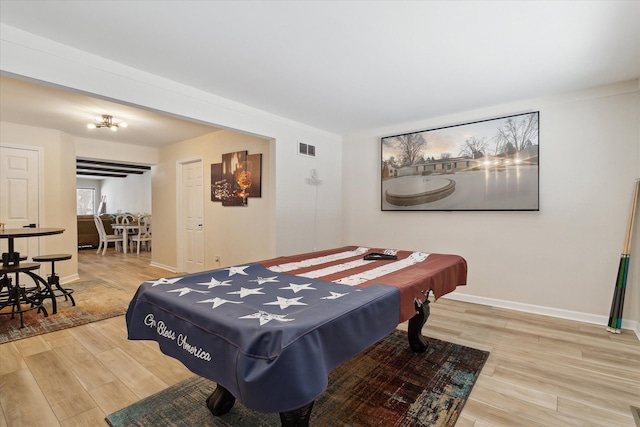 game room with hardwood / wood-style flooring