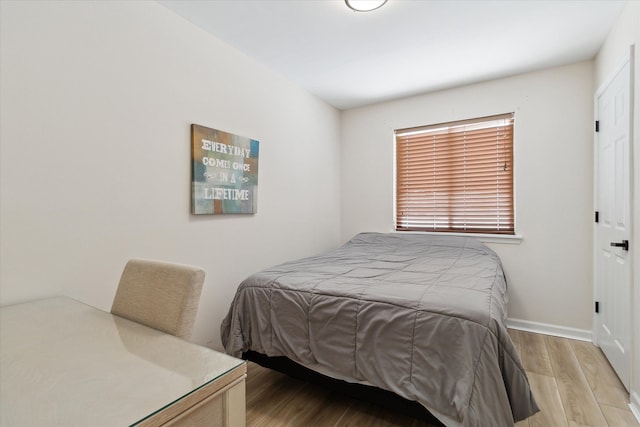 bedroom with light hardwood / wood-style flooring