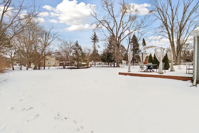 view of yard layered in snow