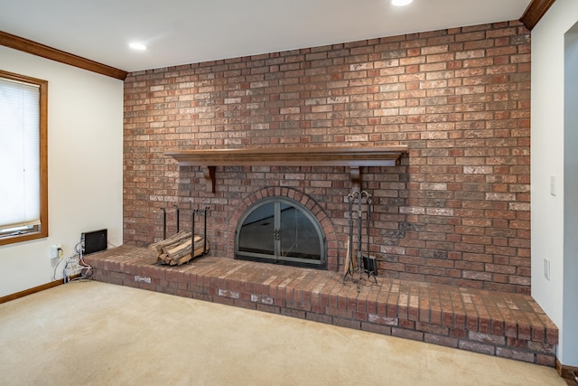 interior details with recessed lighting, baseboards, a brick fireplace, carpet, and crown molding