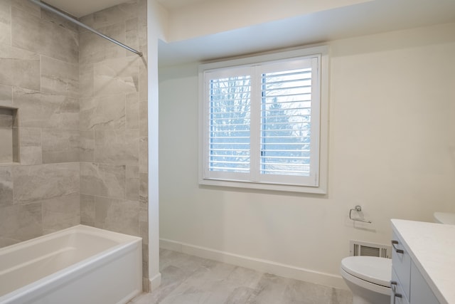 bathroom with a healthy amount of sunlight, visible vents, toilet, and vanity