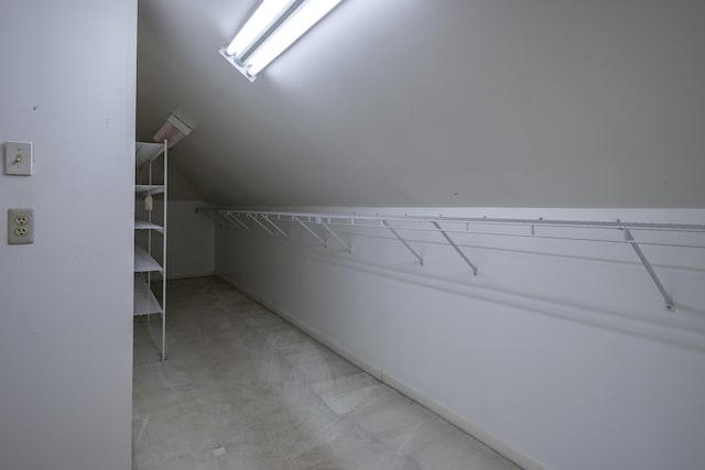 spacious closet featuring lofted ceiling