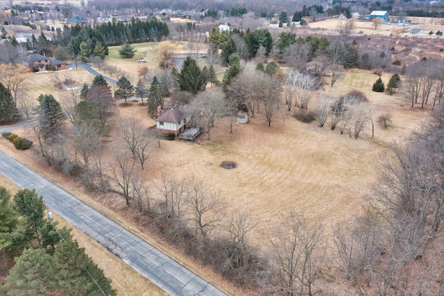 birds eye view of property with a rural view