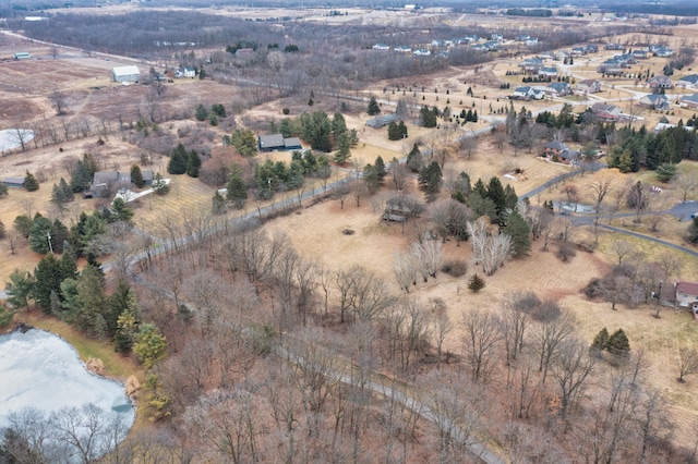 birds eye view of property featuring a rural view