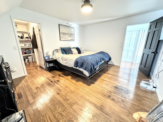 bedroom with hardwood / wood-style flooring