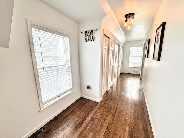 hallway featuring dark wood-type flooring