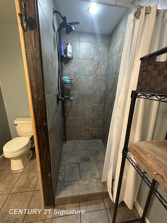 bathroom with walk in shower and toilet