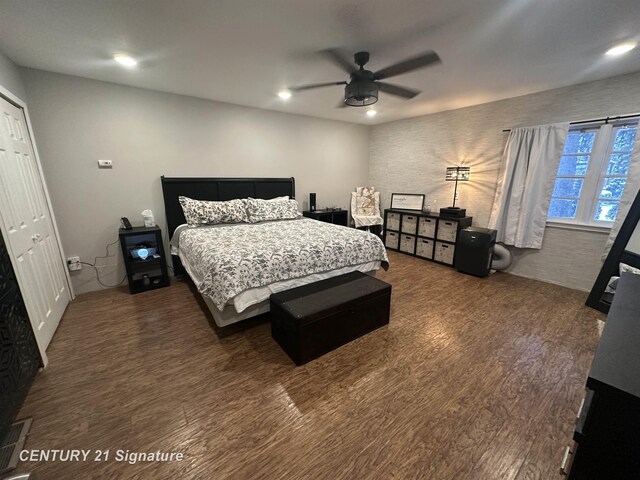 bedroom with dark wood-type flooring and ceiling fan