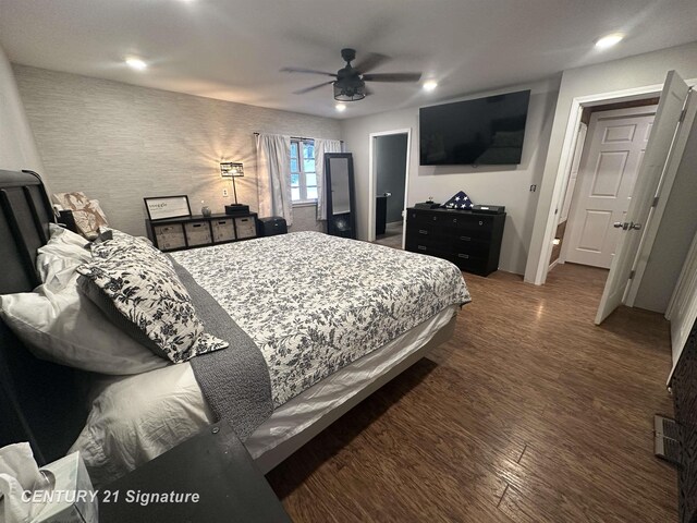 bedroom with dark wood-type flooring and ceiling fan