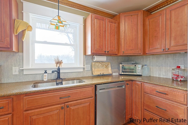 kitchen with sink, stainless steel dishwasher, decorative backsplash, and decorative light fixtures