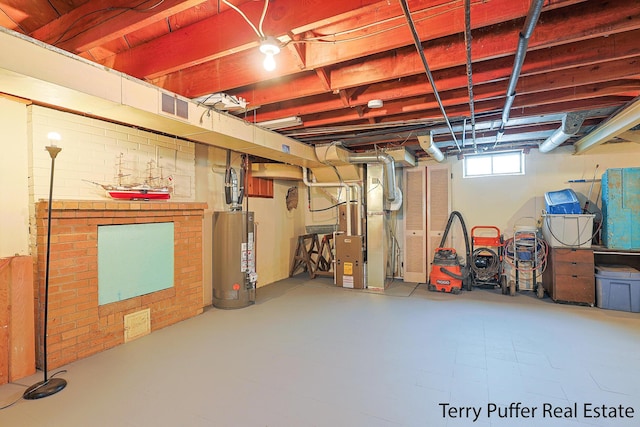 basement with gas water heater and heating unit