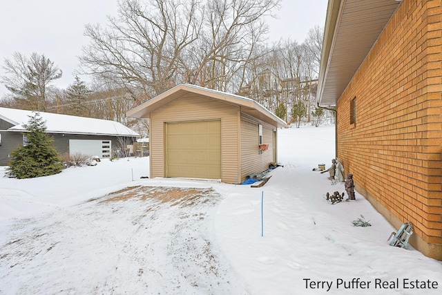 view of snow covered garage