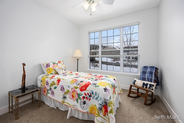 carpeted bedroom with baseboards and ceiling fan