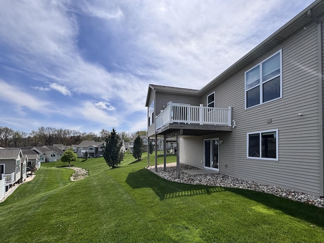 view of yard featuring a residential view and a wooden deck