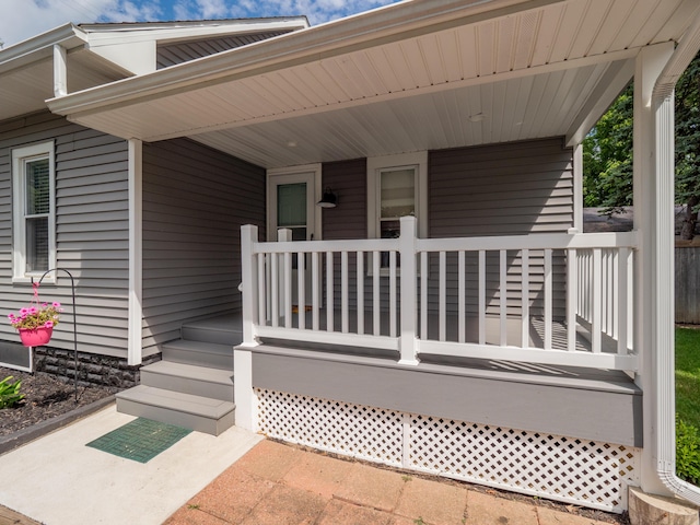 property entrance featuring covered porch