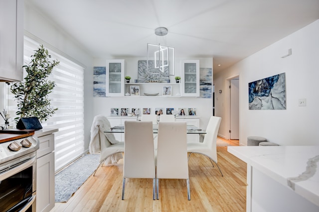 dining space with light hardwood / wood-style floors