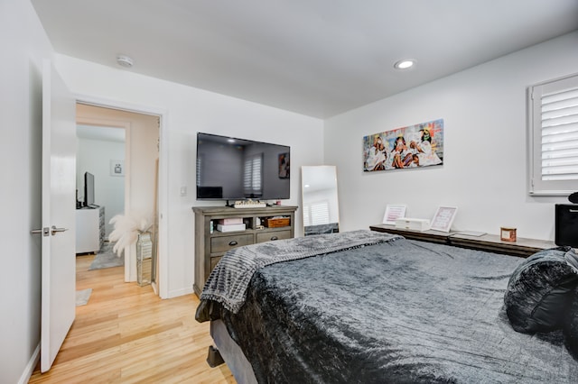 bedroom with light hardwood / wood-style floors