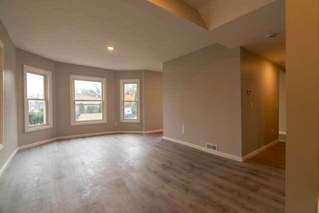 empty room with hardwood / wood-style floors