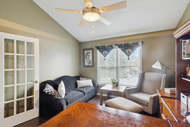 living room with vaulted ceiling, dark wood-type flooring, and ceiling fan