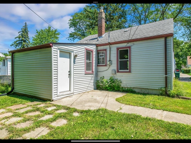 exterior space featuring a lawn and a patio