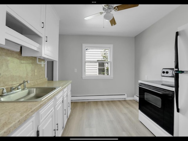 kitchen featuring white cabinetry, sink, white electric range oven, and a baseboard radiator