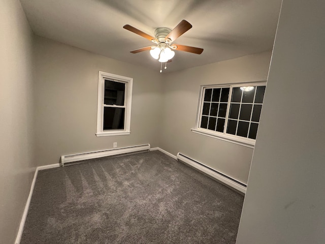 empty room with ceiling fan, carpet, and a baseboard heating unit