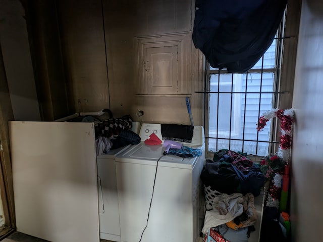 clothes washing area featuring independent washer and dryer